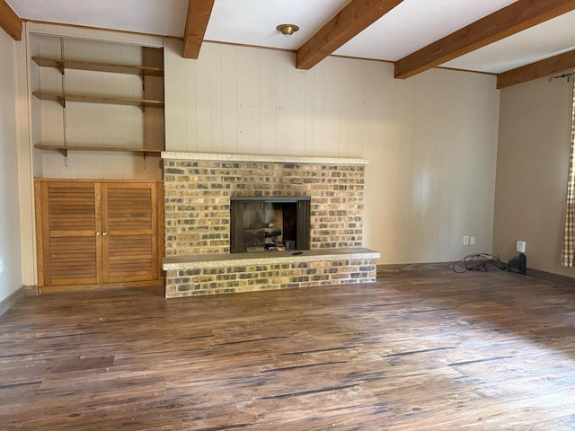 1124 Tullar Rd, Neenah, WI 54956 - unfurnished living room with wood finished floors, beam ceiling, a fireplace, and wooden walls