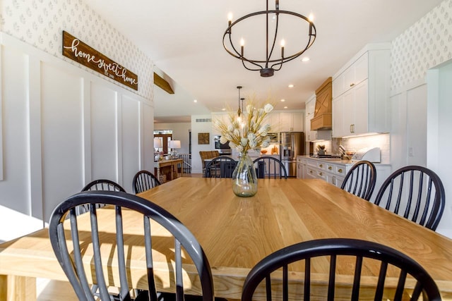 E12785 Wynding Way, Merrimac, WI 53561 - dining area featuring a chandelier, wallpapered walls, and recessed lighting