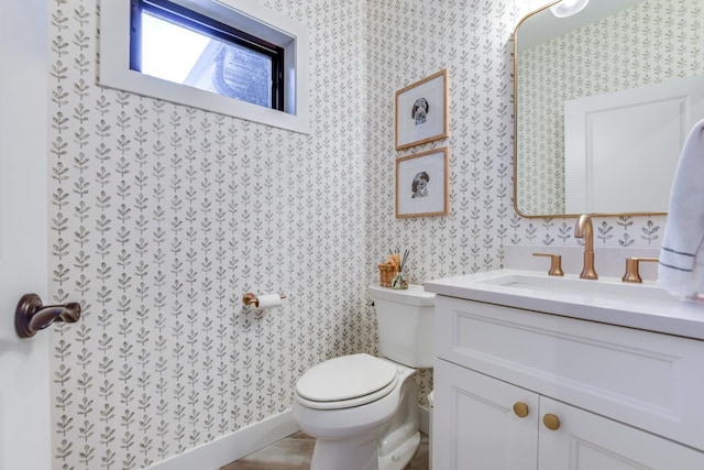 E12785 Wynding Way, Merrimac, WI 53561 - half bathroom with wallpapered walls, vanity, and toilet