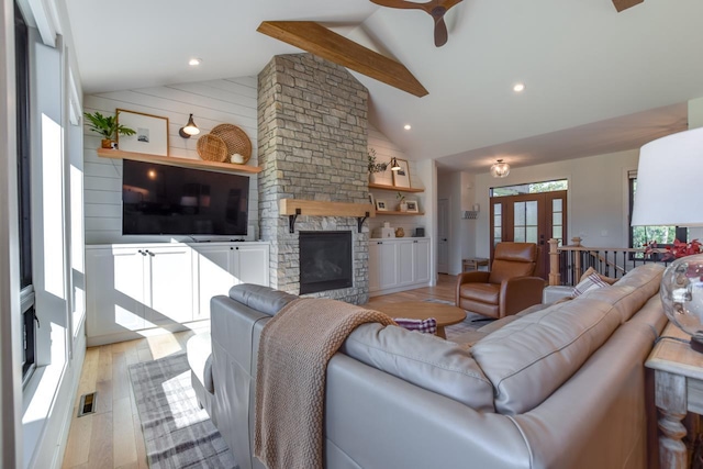 E12785 Wynding Way, Merrimac, WI 53561 - living area featuring high vaulted ceiling, ceiling fan, light wood-style floors, a stone fireplace, and french doors