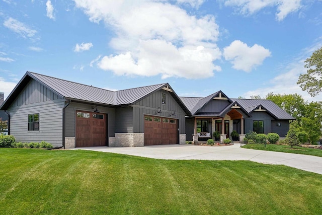 E12785 Wynding Way, Merrimac, WI 53561 - view of front of home featuring board and batten siding, a garage, a front yard, and a standing seam roof