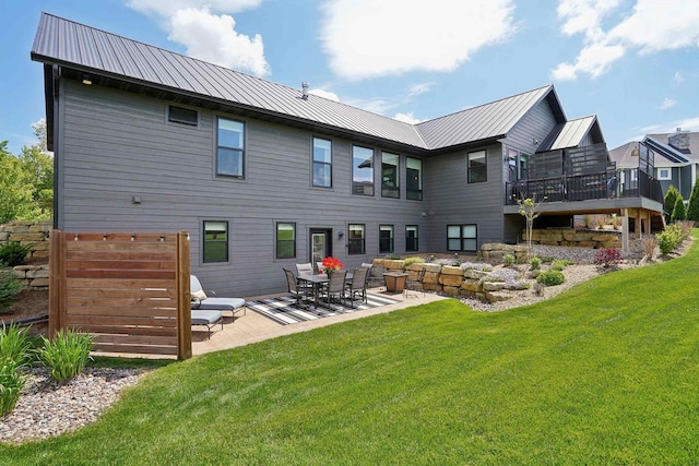 E12785 Wynding Way, Merrimac, WI 53561 - back of property with a lawn, a patio, and metal roof