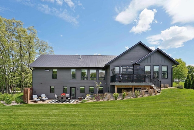 E12785 Wynding Way, Merrimac, WI 53561 - rear view of property featuring a deck, a patio area, a yard, and board and batten siding