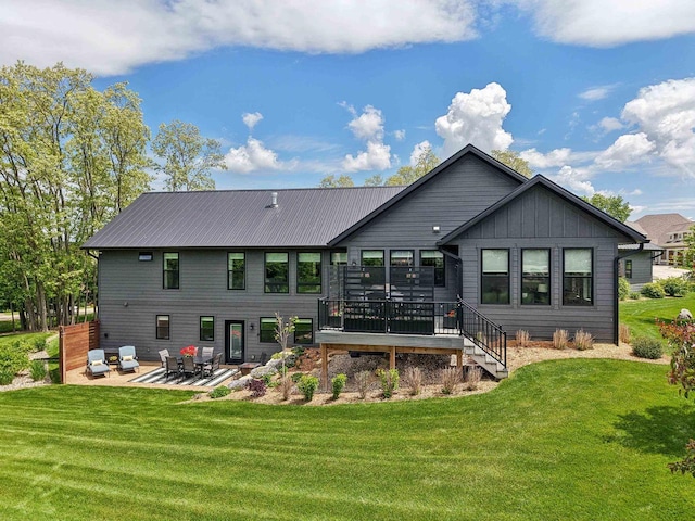 E12785 Wynding Way, Merrimac, WI 53561 - rear view of property with a patio area, a yard, a wooden deck, and board and batten siding