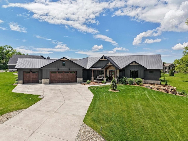E12785 Wynding Way, Merrimac, WI 53561 - modern farmhouse with an attached garage, a front yard, and concrete driveway