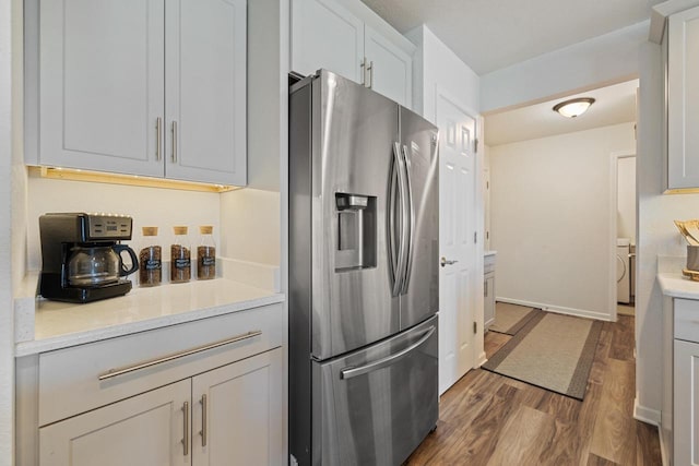 35209 Winnebago Ct, Summit, WI 53066 - kitchen with stainless steel refrigerator with ice dispenser, dark wood finished floors, and light countertops