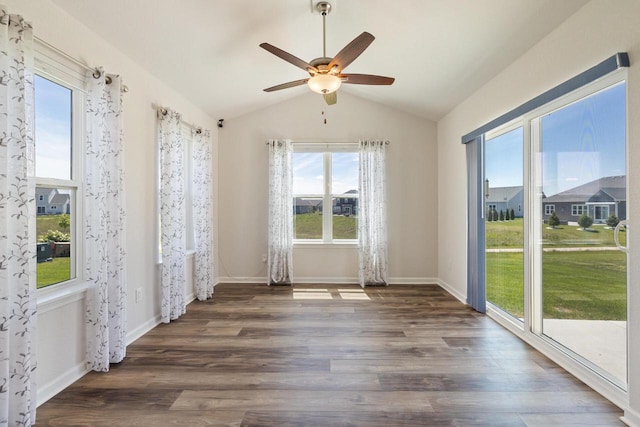 35209 Winnebago Ct, Summit, WI 53066 - unfurnished room featuring a ceiling fan, plenty of natural light, lofted ceiling, dark wood-style flooring, and baseboards