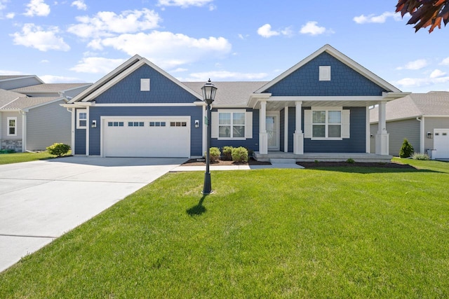 35209 Winnebago Ct, Summit, WI 53066 - view of front of property featuring a garage, driveway, covered porch, and a front yard
