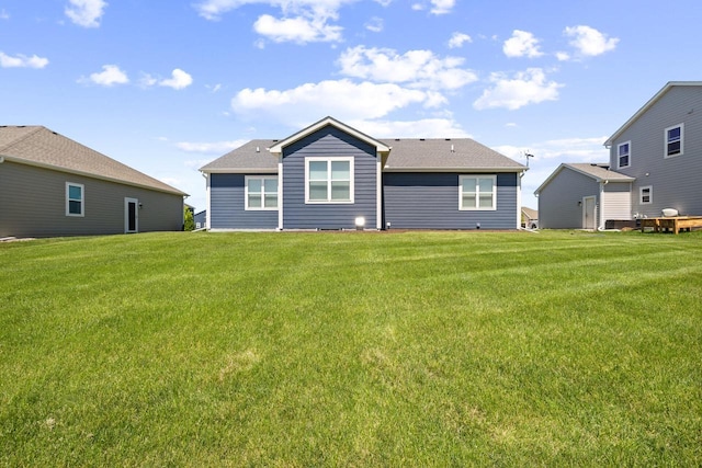 35209 Winnebago Ct, Summit, WI 53066 - back of house featuring a yard and a shingled roof