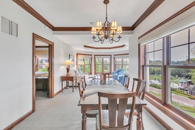 101 Osthoff Ave Unit 302A-B, Elkhart Lake, WI 53020 - carpeted dining area featuring crown molding, a chandelier, and baseboards