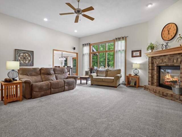 5605 N Mcnichols Dr, Milton, WI 53563 - carpeted living area with a ceiling fan, a fireplace, and recessed lighting