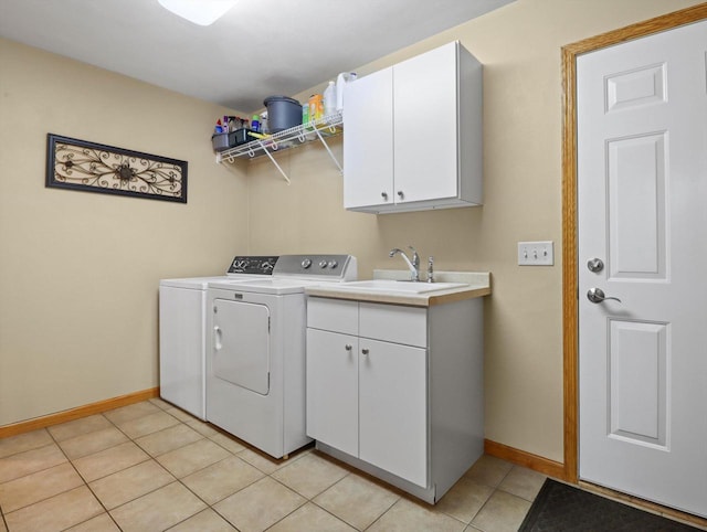 5605 N Mcnichols Dr, Milton, WI 53563 - laundry room featuring independent washer and dryer, baseboards, cabinet space, and light tile patterned floors