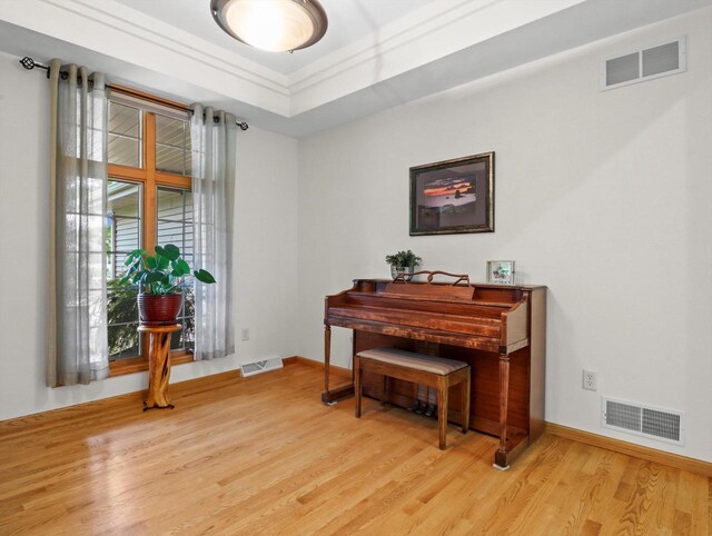 5605 N Mcnichols Dr, Milton, WI 53563 - sitting room with light wood-style flooring, baseboards, and a raised ceiling