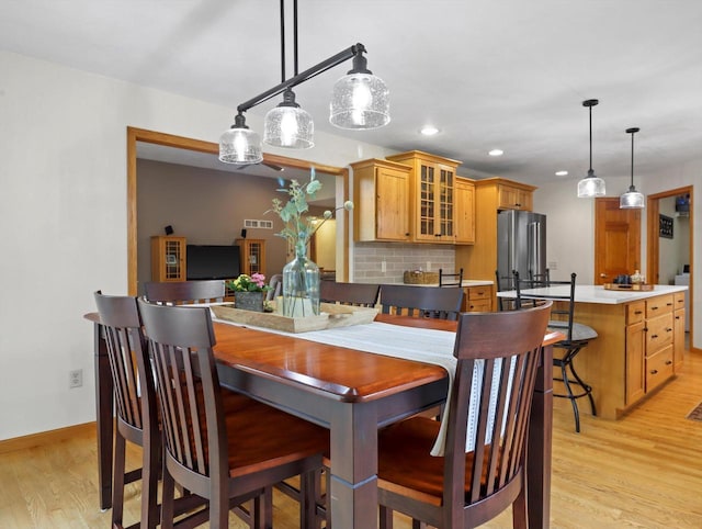 5605 N Mcnichols Dr, Milton, WI 53563 - dining room with light wood-style flooring, recessed lighting, and baseboards