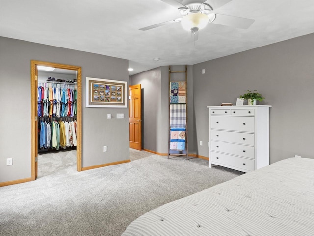 5605 N Mcnichols Dr, Milton, WI 53563 - carpeted bedroom featuring baseboards, a walk in closet, and ceiling fan
