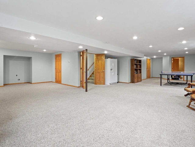 5605 N Mcnichols Dr, Milton, WI 53563 - finished basement featuring white refrigerator with ice dispenser, baseboards, recessed lighting, light carpet, and stairs