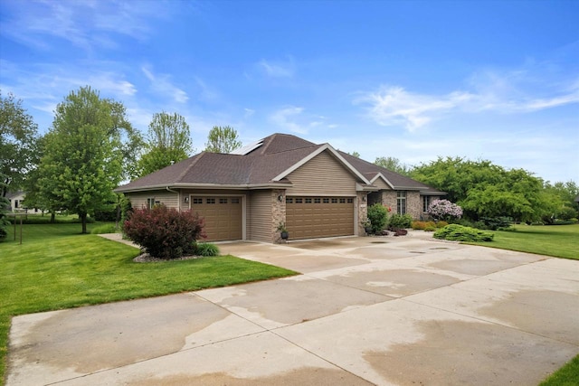 5605 N Mcnichols Dr, Milton, WI 53563 - view of front of home with a garage, a front yard, concrete driveway, and roof with shingles