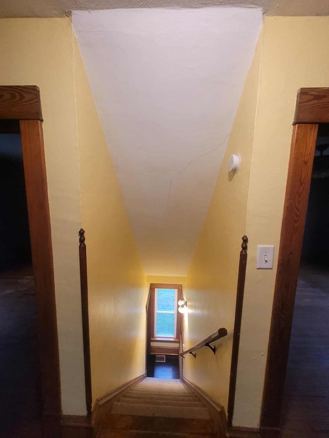 324 N Pine St, Reedsburg, WI 53959 - stairway featuring baseboards and vaulted ceiling