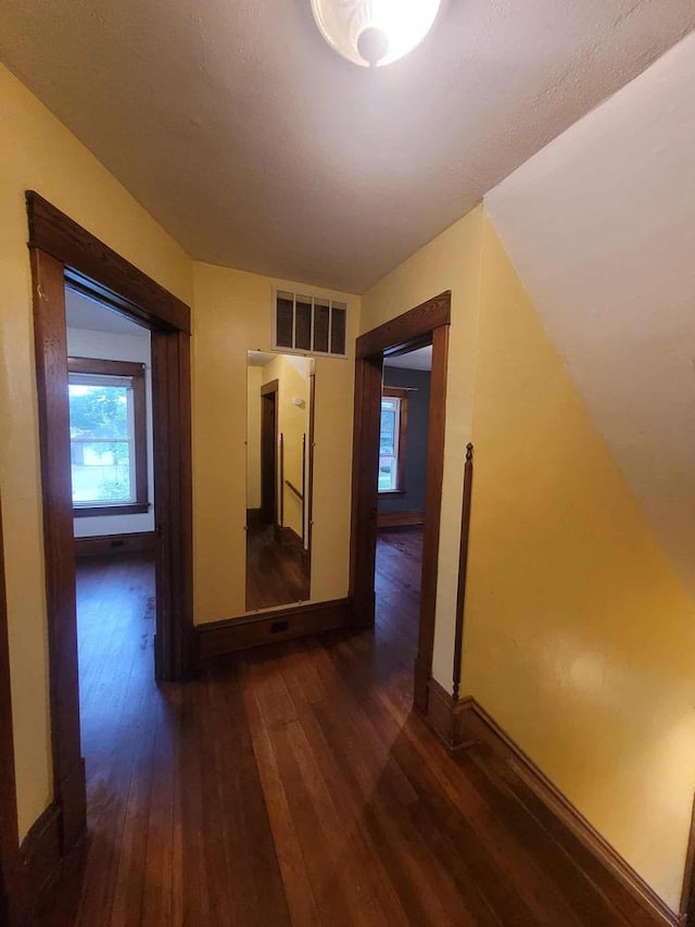 324 N Pine St, Reedsburg, WI 53959 - hall featuring dark wood-style flooring and baseboards
