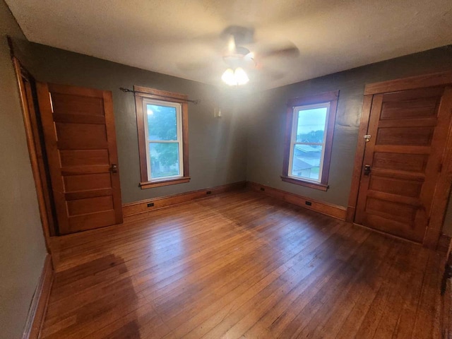 324 N Pine St, Reedsburg, WI 53959 - empty room featuring hardwood / wood-style flooring, baseboards, and ceiling fan