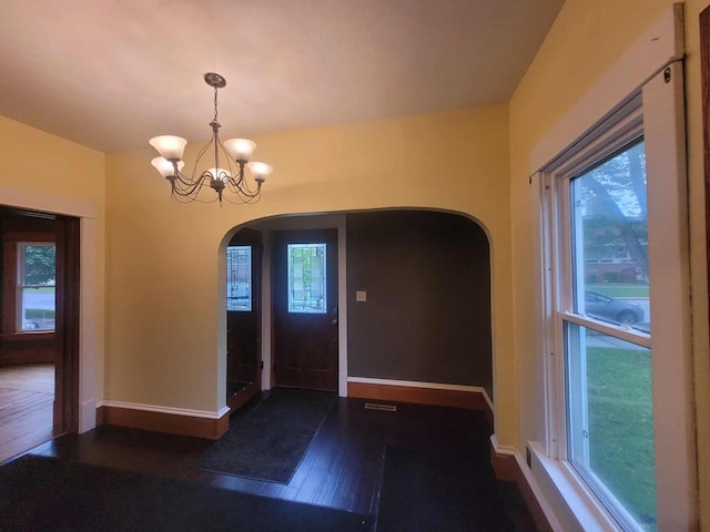 324 N Pine St, Reedsburg, WI 53959 - entrance foyer with arched walkways, plenty of natural light, and wood-type flooring