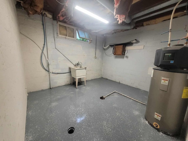 324 N Pine St, Reedsburg, WI 53959 - unfinished below grade area with water heater and a sink