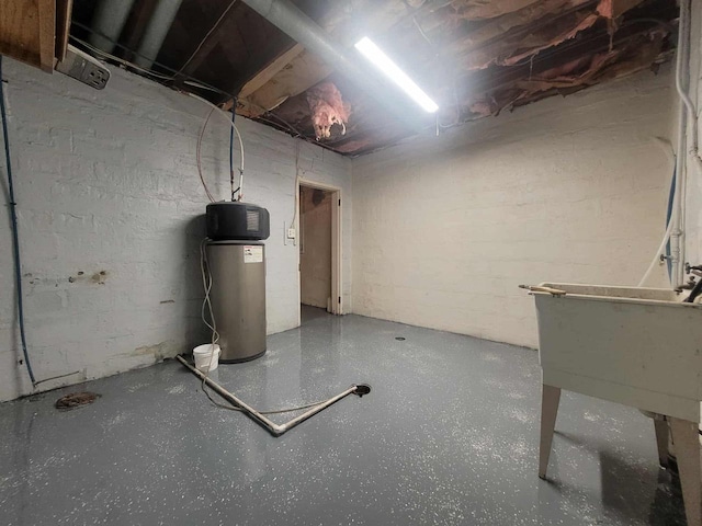 324 N Pine St, Reedsburg, WI 53959 - unfinished basement with a water softener, concrete block wall, and a sink
