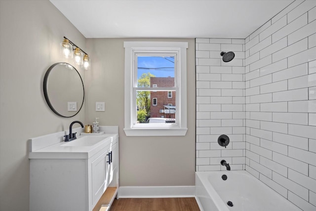 1114 E Manitoba St, Milwaukee, WI 53207 - full bathroom with vanity, wood finished floors, shower / bath combination, and baseboards