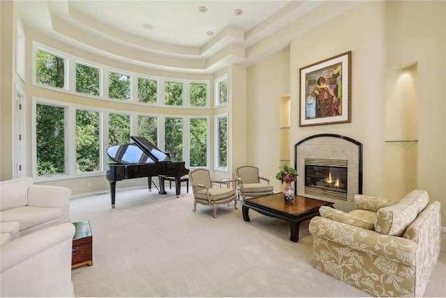 689 Brookside Ln, Mendota Heights, MN 55118 - living area with carpet, a towering ceiling, plenty of natural light, a glass covered fireplace, and a tray ceiling