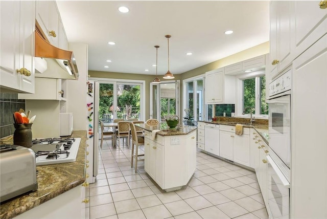 689 Brookside Ln, Mendota Heights, MN 55118 - kitchen featuring white appliances, white cabinetry, recessed lighting, a kitchen island, and pendant lighting