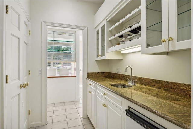 689 Brookside Ln, Mendota Heights, MN 55118 - kitchen with a sink, white dishwasher, dark stone countertops, white cabinetry, and light tile patterned floors