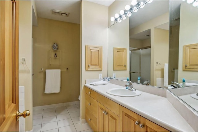 689 Brookside Ln, Mendota Heights, MN 55118 - full bathroom with tile patterned floors, an enclosed shower, vanity, and toilet