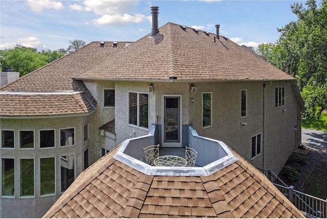 689 Brookside Ln, Mendota Heights, MN 55118 - rear view of house featuring a shingled roof and stucco siding