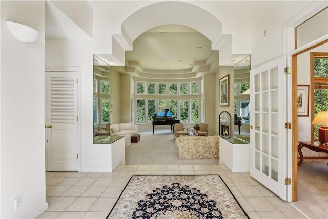 689 Brookside Ln, Mendota Heights, MN 55118 - foyer entrance featuring light tile patterned floors, french doors, baseboards, and light carpet