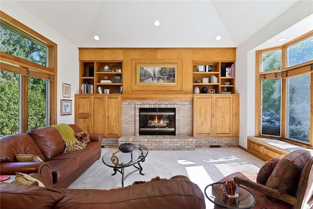 689 Brookside Ln, Mendota Heights, MN 55118 - living area with high vaulted ceiling, a fireplace, built in shelves, light carpet, and recessed lighting