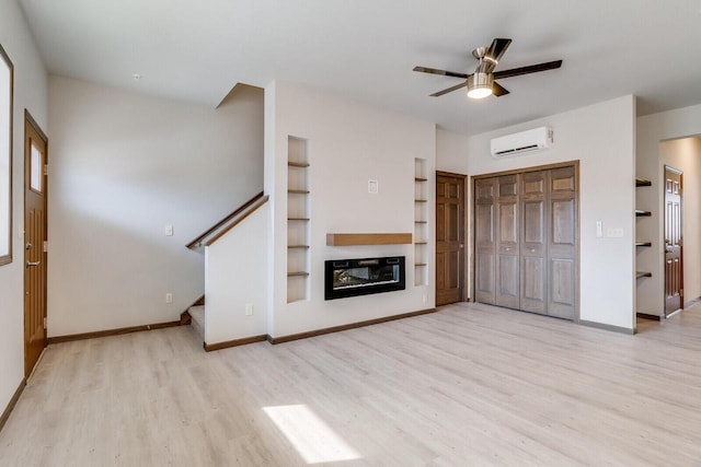 1325 Hagar St, La Crosse, WI 54603 - unfurnished living room with a wall mounted air conditioner, wood finished floors, built in shelves, and a ceiling fan