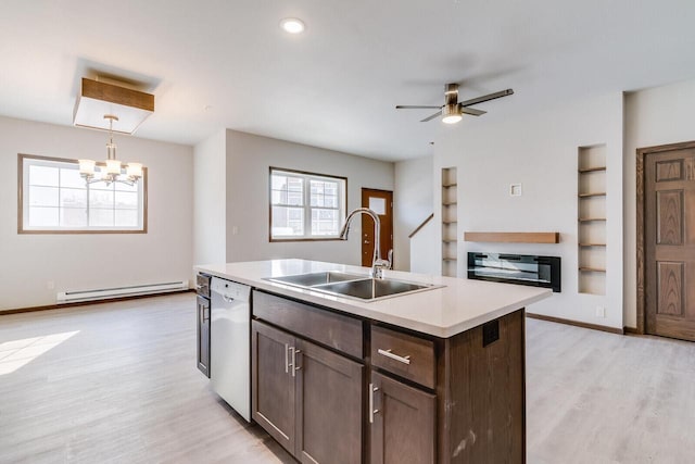 1325 Hagar St, La Crosse, WI 54603 - kitchen featuring a sink, white dishwasher, a baseboard radiator, light wood-type flooring, and healthy amount of natural light