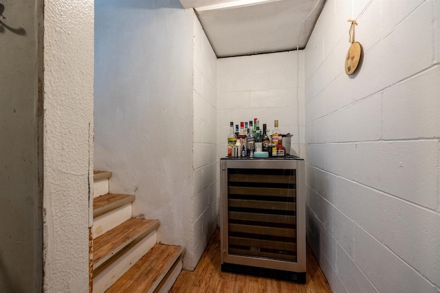 841 4th St S, Wisconsin Rapids, WI 54494 - indoor dry bar with wine cooler, wood finished floors, and stairway