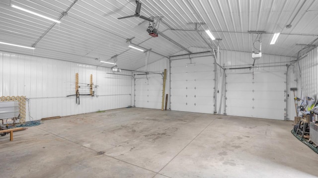 323 Autumn Ln, Campbellsport, WI 53010 - garage with a garage door opener and metal wall