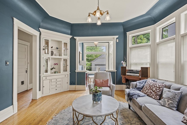 2710 N Hackett Ave, Milwaukee, WI 53211 - living area featuring a chandelier and light wood-style flooring