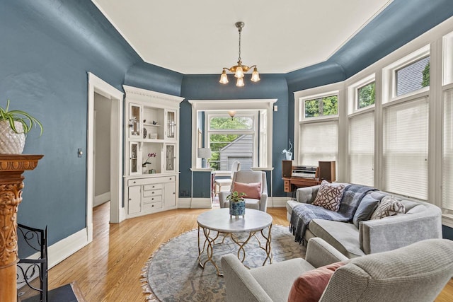 2710 N Hackett Ave, Milwaukee, WI 53211 - living room featuring a chandelier, healthy amount of natural light, and light wood-style flooring