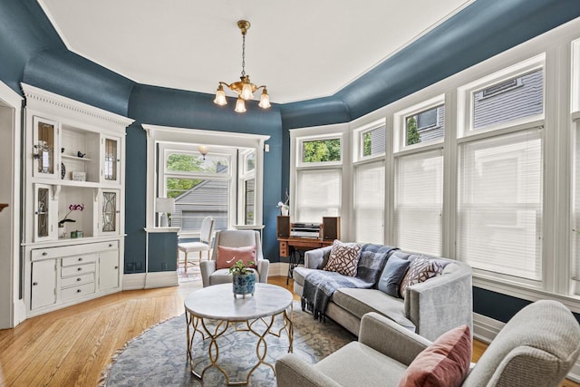 2710 N Hackett Ave, Milwaukee, WI 53211 - living room featuring a chandelier and hardwood / wood-style floors
