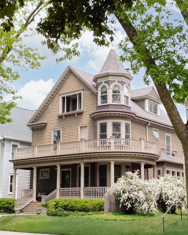 2710 N Hackett Ave, Milwaukee, WI 53211 - victorian-style house featuring covered porch