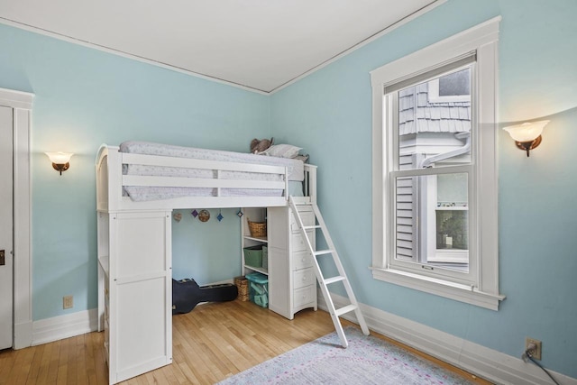 2710 N Hackett Ave, Milwaukee, WI 53211 - bedroom featuring hardwood / wood-style flooring and baseboards