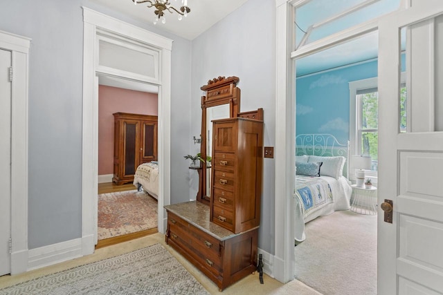 2710 N Hackett Ave, Milwaukee, WI 53211 - corridor featuring light carpet and a chandelier