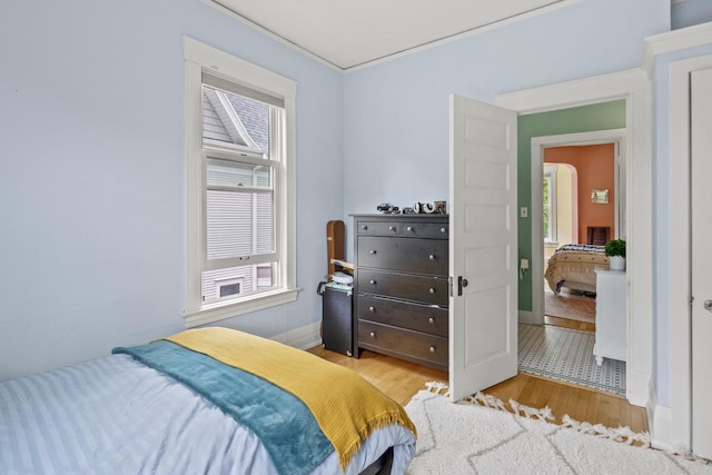 2710 N Hackett Ave, Milwaukee, WI 53211 - bedroom with wood finished floors and multiple windows