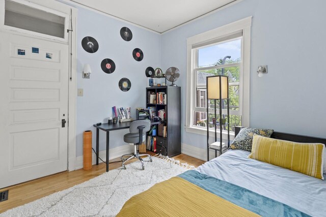 2710 N Hackett Ave, Milwaukee, WI 53211 - bedroom with wood finished floors and an office area
