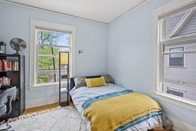 2710 N Hackett Ave, Milwaukee, WI 53211 - bedroom featuring wood finished floors, ornamental molding, and an office area