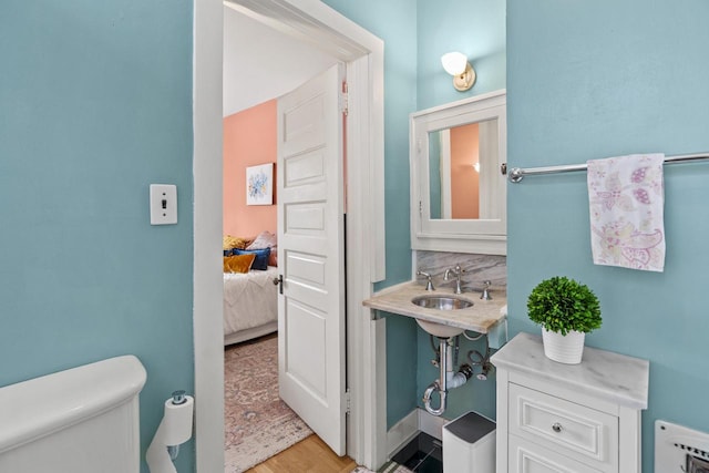 2710 N Hackett Ave, Milwaukee, WI 53211 - half bathroom featuring wood finished floors and connected bathroom