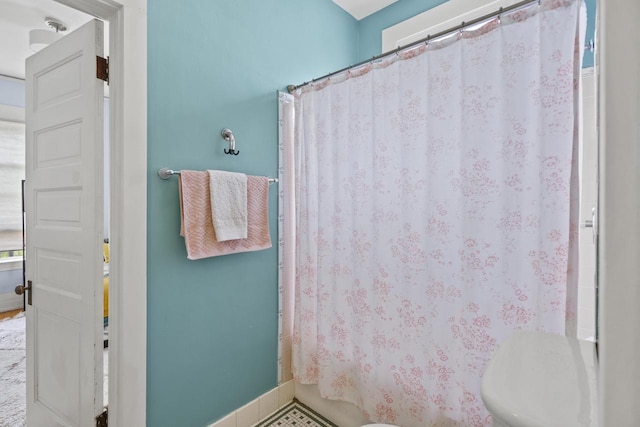 2710 N Hackett Ave, Milwaukee, WI 53211 - bathroom with toilet and a shower with shower curtain